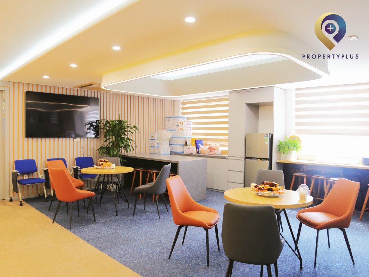 Reception area with wooden desk and friendly staff at Hapro Building